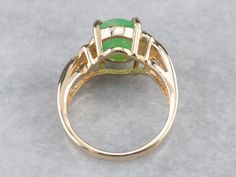 This pretty vintage ring is a rich combination of yellow gold and sweet apple green dyed jade. The metalwork around the stone is simple and subtle, with just a light pattern gracing the simple shoulders! Metal: 14K Yellow Gold Gem: Dyed Jade Gem Measurements: 10.9 x 8.4 mm, Oval Ring Size: 5.75 Marks: "STULLER@14K*" Stamped on the inside band Luxury Jade Rings In Fine Jewelry Style, Luxury Jade Rings Fine Jewelry, Luxury Elegant Jade Rings, Luxury Jade Ring With Polished Finish, Luxury Polished Jade Rings, Aquamarine Cocktail Ring, Light Pattern, Right Hand Ring, Demantoid Garnet