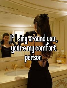 a woman standing in front of a bathroom mirror with the caption if i sing around you, you're my comfort person