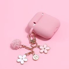 a pink cell phone case and keychain on a pink background