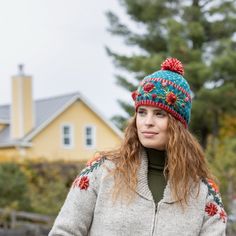 A statement piece if ever there was one, the Aubrey Beanie uses textured stitch to create eye-catching floral patterns reminiscent of hoop embroidery. Finished with a cute two-tone pompom on top and lined around the band for warmth. This design is also available as a headband, hand warmers and socks. 100% wool Fleece-lined band Handmade in Nepal Fair Trade Federation Member Dry clean/hand-wash only