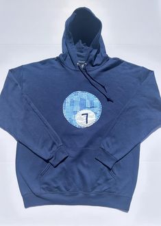 a blue sweatshirt with the letter f on it's chest and an oval logo