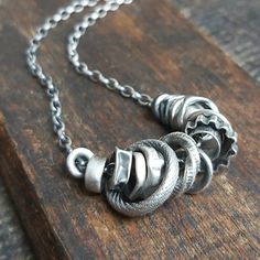 "Handmade oxidized textured sterling silver necklace with many elements - Valentine gift for your loved one It is available with either raw or polished finish. We offer necklaces in many sizes: 16\" (40 cm), 18\" (45 cm), 20\" (50 cm), 22\" (55 cm), 24\" (60 cm), 26\" (65 cm). Each necklace has an adjusttable - 2\" (5 cm). We send jewelry in an elegant box. Thanks for visiting Treendystudio!" Antique Silver Hand Forged Sterling Silver Necklaces, Hand Forged Sterling Silver Necklace In Antique Silver, Silver Sterling Chain Necklace With Oxidized Finish, Hand Forged Antique Silver Sterling Necklace, Hand Forged Silver Metal Chain Necklace, Brutalist Sterling Silver Pendant Necklace, Sterling Silver Pendant Chain Necklace With Oxidized Finish, Silver Sterling Silver Brutalist Necklace, Silver Brutalist Jewelry With Oxidized Finish