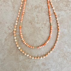 The Pessego necklace is perfect for adding a touch of summer style to your wardrobe. Crafted from bamboo coral in a pale peach hue and adorned with gold spacer beads, the delicate necklace provides an elegant, sophisticated look. Perfect for any occasion, this necklace exudes summer vibes. Super cute and feminine piece to wear alone or for layering. You have a choice of two different styles and lengths. Beads 2mm color enhanced Gold spacer 2mm + Findings 14K GF Bamboo Coral, Pale Peach, Elegant Sophisticated, Coral Necklace, Shiny Things, Delicate Necklace, Spacer Beads, Summer Style, Summer Vibes