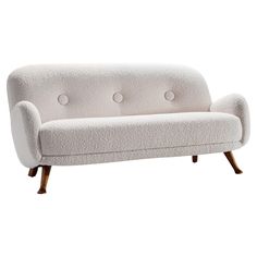 a white couch sitting on top of a wooden frame