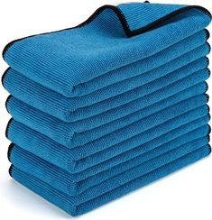 a stack of blue towels sitting on top of each other