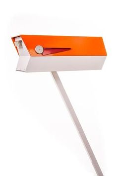 an orange and white box with a pair of scissors in it's opening hole