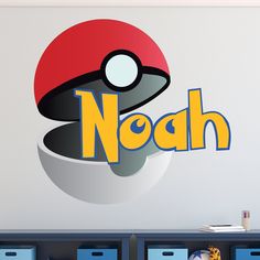 a wall decal with the word noah in front of a pokeball logo on it