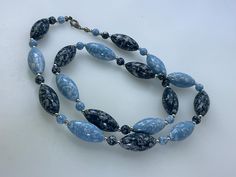 Vintage 24" Necklace With Silver Toned And Blue White Mottled Plastic Beads Used Blue Oval Beads Necklace With Beaded Chain, Vintage Blue Oval Bead Necklace, Vintage Blue Necklace With Oval Beads, Vintage Blue Necklaces With Oval Beads, Blue Beaded Necklaces With Oval Beads, Blue Oval Beaded Necklaces, Blue Oval Beaded Chain Necklaces, Blue Beaded Chain Necklace With Oval Beads, Blue Necklace With Oval Beads