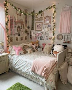 a dog laying on top of a bed in a bedroom next to two stuffed animals