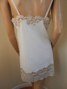 poly slip in excellent condition with tons of lace adjust able straps length 34 two way stretch great condition slightly yellow in color Lace Slip Dress With Built-in Bra For Daywear, Wedding Night Chemise With Built-in Bra And Spaghetti Straps, Sleepwear Cami Chemise With Lace Trim, Lace Trim Cami Sleep Chemise, Lace Camisole With Spaghetti Straps For Sleep, Spaghetti Straps Chemise With Built-in Bra For Wedding Night, Wedding Night Chemise With Spaghetti Straps And Built-in Bra, Sleep Chemise With Lace Trim In Camisole Shape, Sleep Chemise With Lace Trim Camisole