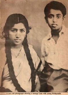 an old black and white photo of two people posing for the camera with long braids in their hair