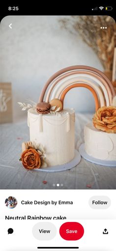 the cake is white and has brown decorations on it, along with an orange rose