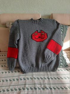 "This listing is for a handmade video game inspired sweater. It is crafted of high quality wool 49% , acrylic 51% blend. Chest Measurements for women Size S - 34- 36\" Size M - 36-38\" Size L - 39-40\" Size XL- 41-42\" Size XXL- 43-44\" If you want it oversize, please, state this in personification section. We will add 3\" for oversize fitting. For custom orders the processing time is 3-4 weeks. Please, feel free to ask any questions as for the custom orders! Thank you for visiting my shop!" Acrylic Crew Neck Knit Sweater, Handmade Wool Sweater With Long Sleeves, Wool Crew Neck Knitted Sweater, Wool Crew Neck Sweater With Knitting Details, Handmade Knit Sweater With Crew Neck, Casual Handmade Crew Neck Sweater, Red Hand Knitted Crew Neck Sweater, Measurements For Women, Hand Knit Sweater