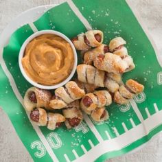 a plate full of food sitting on top of a green cloth next to a measuring tape