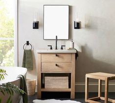 a bathroom with a sink, mirror and stool