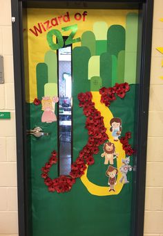 a door decorated with paper flowers and the number twenty seven on it's side