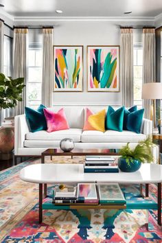 a living room with white couches and colorful pillows