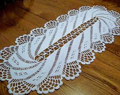 a white doily is laying on the floor