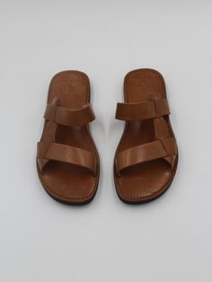 These stylish handmade leather men sandals feature a comfortably smooth base with a thick strap, to give you a unique sandals style made with love and patience just for you from Morocco Marrakech  They are made from 100% Genuine cow Leather. And Sole made from rubber to make it waterproof. Leather Toe Ring Sandals With Rubber Sole For Vacation, Leather Double Strap Toe Ring Sandals For Beach, Leather Footbed Toe Loop Huarache Sandals For Vacation, Summer Huarache Sandals With Leather Lining, Toe Loop Huarache Sandals With Leather Footbed For Vacation, Beach Sandals With Double Strap And Leather Sole, Leather Toe Loop Huarache Sandals For Vacation, Leather Huarache Sandals With Single Toe Strap For Vacation, Leather Barefoot Sandals For Vacation