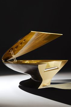 a gold plate sitting on top of a black table