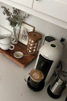 A picture of a cute coffee nook on a kitchen counter. Nicely decorated and inspirational. Coffee Station Kitchen, Coffee Area, Coffee Bar Station, Neutral Kitchen, Coffee Bars In Kitchen, Coffee Nook, Home Coffee Bar