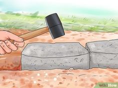 a hammer hitting an object in the ground