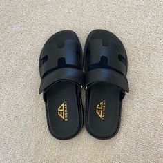 -Brand New, Never Worn -Size 6 Women’s -Tagged Brand For Exposure Black Closed Toe Slides For Summer, Black Closed Toe Summer Slippers, Black Round Toe Flip Flops With Rubber Sole, Black Round Toe Slippers For Spring, Black Leather Slippers With Textured Footbed, Black Slip-on Slippers For Vacation, Black Rubber Sole Mules For The Beach, Black Rubber Sole Mules For Beach, Black Mules With Rubber Sole For Beach