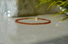 "This dainty bracelet is made of genuine faceted Hessonite Garnet. This bracelet is in burnt orange shades, which is the color of this season. Would make a great gift for January Birthdays, bridesmaids or just each person for the healing purpose. Garnet - shields you from negativity on your spiritual journey. They also stimulate the brain, strengthening logical reasoning, mental clarity and activating imaginative thinking. . ❗️Sign up to our Newsletter and get 15% OFF your order (copy this link Elegant Orange Gemstone Beaded Bracelets, Elegant Orange Beaded Bracelets With Gemstones, Elegant Orange Bracelets With Faceted Beads, Elegant Orange Gemstone Beaded Bracelet, Elegant Orange Gemstone Bracelet, Orange Rondelle Jewelry For Gift, Logical Reasoning, Orange Shades, Orange Bracelet