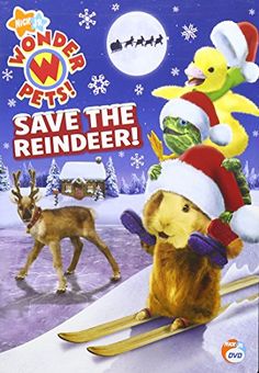 an animal riding on top of a snow covered slope next to another animal wearing a santa hat