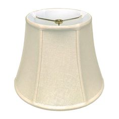 a white lamp shade with a gold trim