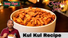 a man holding a bowl full of food with the words kul kul recipe