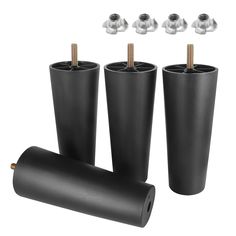 four black plastic cups with screws on top and one in the middle next to each other