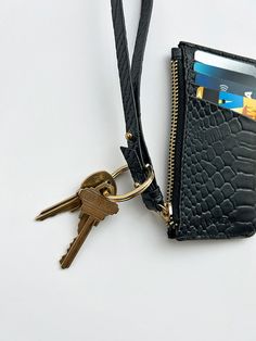 This slim and lightweight cardcase is an every day essential to throw in any bag or in your pocket. It features a 7” wristlet pull with metal pegs that open to accommodate your keys. The exterior has four dedicated card slots and the main zippered compartment holds additional cards and/or cash. Redefine your everyday carry with a touch of luxury and practical elegance. PLAY CARDCASE FEATURES Sustainable Up-cycled embossed leather 100% cotton twill lining 7" Wristlet pull with key slot 4 Exterior Changing Pad, Pet Mat, Everyday Carry, Small Leather Goods, Black Backpack, Cotton Totes, Cotton Tote Bags, Embossed Leather, Water Repellent