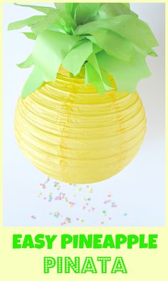 an easy pineapple pinata hanging from the ceiling