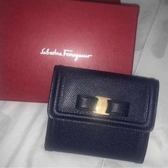 Brand New With Tags And Box 100% Authentic Women’s Salvatore Ferragamo Wallet In Navy Formal Blue Bags With Card Slots, Formal Compact Bag With Original Box, Designer Blue Wallet For Formal Occasions, Designer Blue Wallets For Formal Occasion, Luxury Blue Wallet For Formal Occasions, Elegant Compact Wallets For Formal Occasions, Elegant Compact Wallet For Formal Occasions, Elegant Bifold Wallet For Office, Elegant Blue Wallets