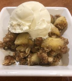 a white plate topped with fruit and ice cream