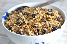 a bowl filled with granola sitting on top of a table