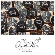 some cookies that are decorated with black and white icing