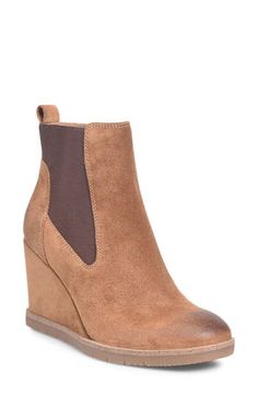 Stretchy side panels and a rear pull-tab lend easy wear to a trend-savvy Chelsea boot lifted by a wrapped wedge heel for a contemporary aesthetic. Cushioned footbed with arch support Leather upper and lining/synthetic sole Imported Brown Suede Platform Wedge Boots, Casual Wedge Heel Boots With Reinforced Heel, Suede Wedge Boots For Fall, Fall Wedge Heel Boots In Medium Width, Fall Suede Wedge Heel Boots, Fall Suede Wedge Boots, Casual Brown Wedge Boots With Reinforced Heel, Modern Wedge Heel Boots For Fall, Fall Wedge Boots With Medium Width