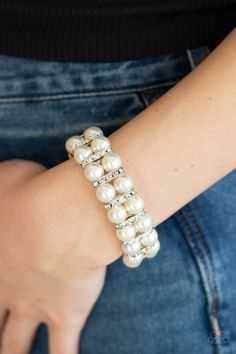 Pairs of pearly white beads and white rhinestone encrusted silver fittings are threaded along an invisible wire around the wrist for a refined flair. Features an adjustable clasp closure. Sold as one individual bracelet. White Bracelets, Jewelry Show, Paparazzi Accessories, Stretchy Bracelets, White Jewelry, White Rhinestone, Bracelet Clasps, Paparazzi Jewelry, Trendy Accessories