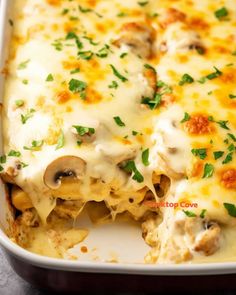 a casserole dish with mushrooms and cheese