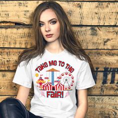 Get ready for fair season with our "Take Me to the Fair" Shirt! This State and County Fair T-shirt is perfect for summertime festivals, capturing the joy of Ferris wheels, Big Tex, and cotton candy. Whether you're exploring rides or indulging in sweet treats, this tee is a fun and festive must-have. Ideal for celebrating fair days in style, it's the perfect way to show your love for the fair. Grab your Summertime Festival Tee today and enjoy the ride! • 100% combed and ring-spun cotton (Heather Fair Season, Fair Day, Ferris Wheels, Roller Coasters, Family Women, Matching Swimwear, County Fair, State Fair, The Fair