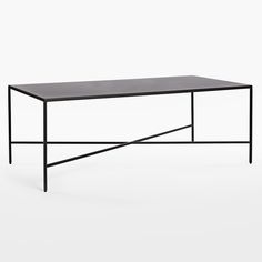 a black table with metal legs on a white background and an empty space for the top