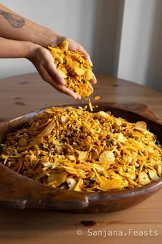 a person is scooping some food out of a bowl