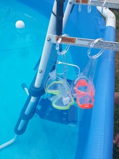 two snorkels are attached to the side of an inflatable pool