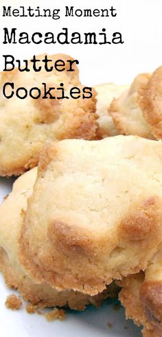 some biscuits that are sitting on a white plate with the words melting moment macadamia butter cookies