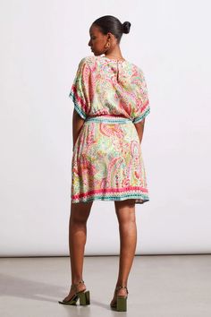 Add a rush of color to your collection with this v-neck dress featuring border prints and flowy dolman sleeves. We're also loving the additional waist accent and the functional back-of-neck opening. V-neckline Dolman sleeveBack neck functional opening Waist accent Machine wash delicate cycle cold water, separately, do not bleach, line dry, medium iron if needed. Multicolor Short Sleeve V-neck Dress For Vacation, Bohemian Multicolor V-neck Dress With Short Sleeves, Flowy V-neck Tunic For Beach Cover-up, Boho Print Rayon V-neck Dress, Flowy V-neck Boho Print Dress, V-neck Viscose Kaftan For The Beach, Vibrant Print V-neck Tunic, Green Bohemian V-neck Beach Dress, Multicolor Bohemian Dress With Split Neck