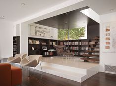 a living room filled with lots of furniture and bookshelves next to each other