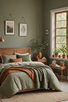 a bed sitting in a bedroom next to a window with potted plants on it