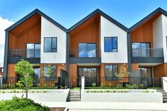 three story townhouses with balconies on the second floor